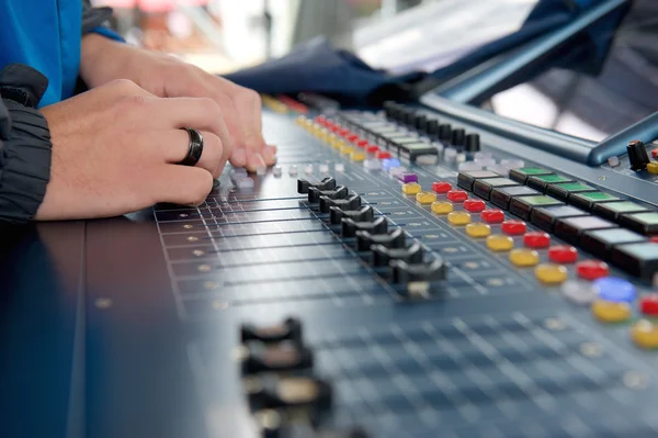 Man operating studio audio mixer — Stock Photo, Image