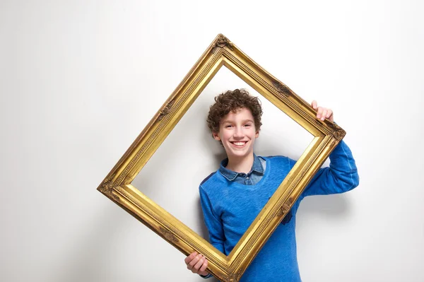 Happy little boy holding picture frame — Stock Photo, Image