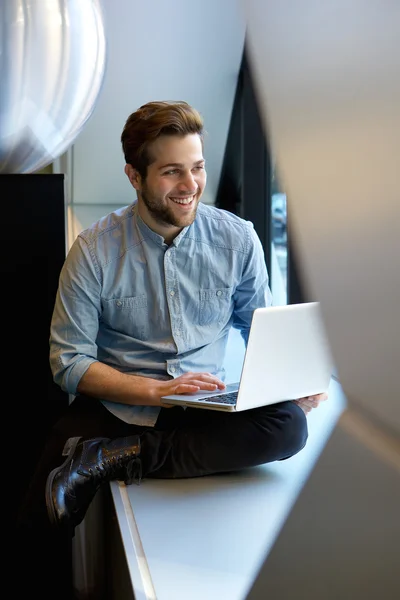 Relaxed man using laptop — Stock Photo, Image