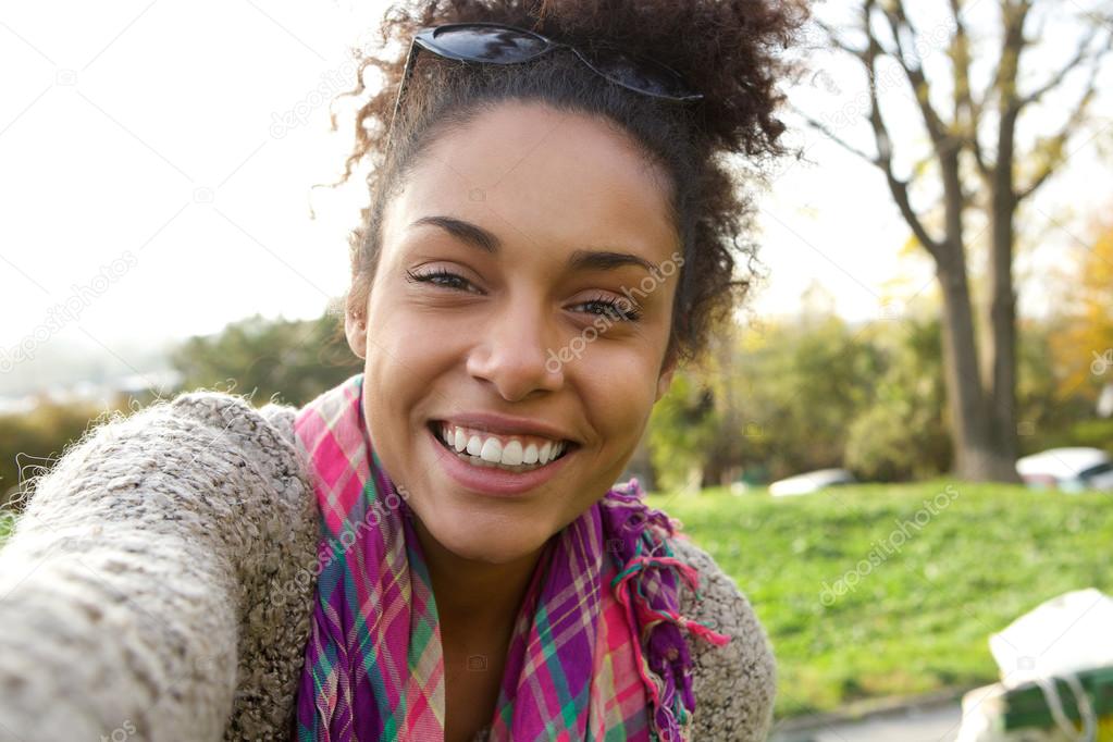 Selfie portrait of a smiling young woman 