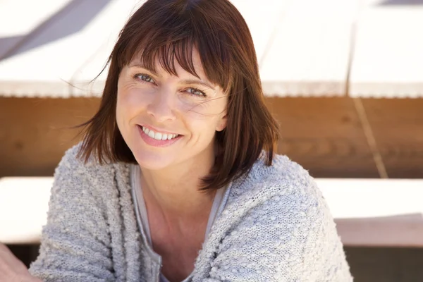 Healthy older woman smiling outside — Stock Photo, Image