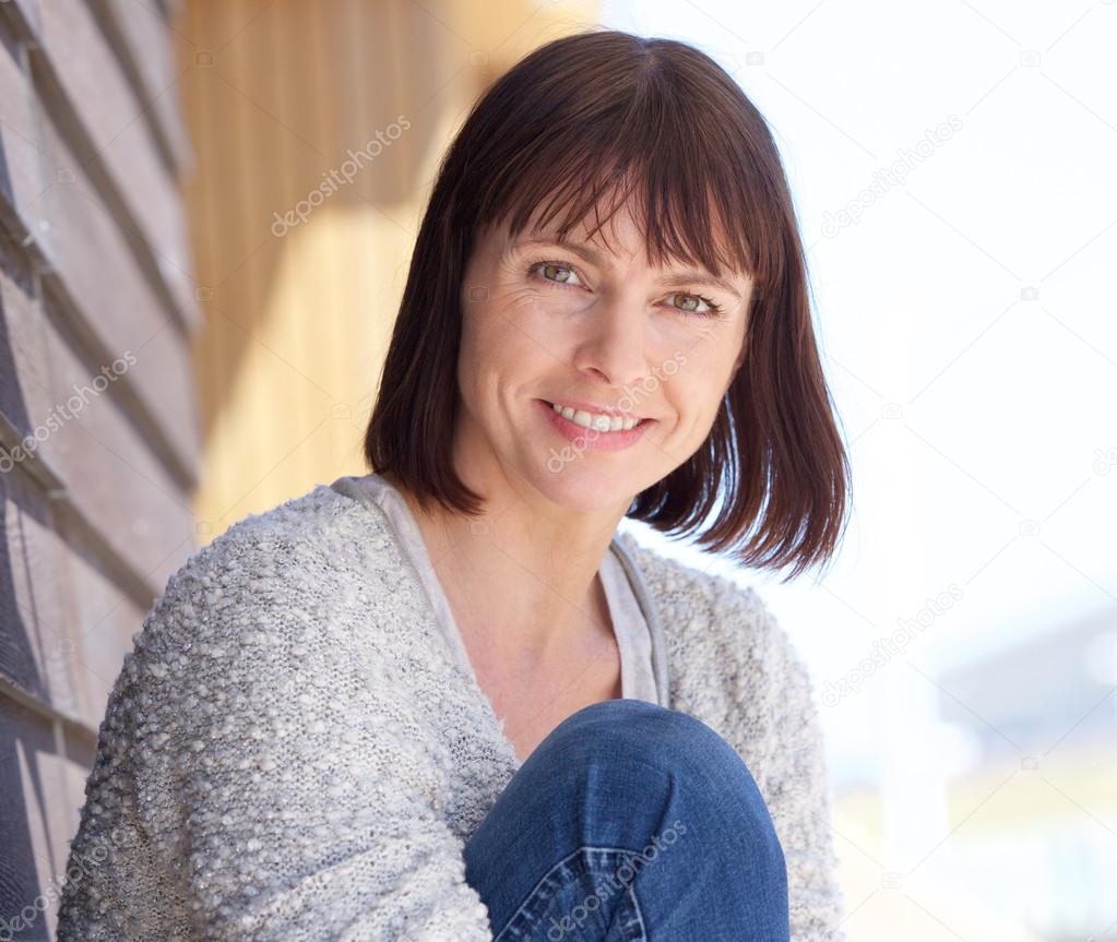 Mature woman smiling outdoors