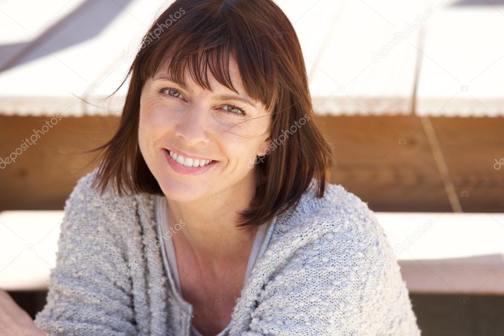 Healthy older woman smiling outside