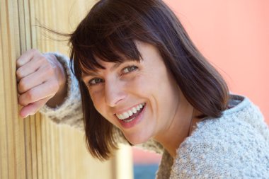 Friendly middle aged woman laughing