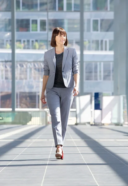 Attractive professional business woman walking — Stock Photo, Image