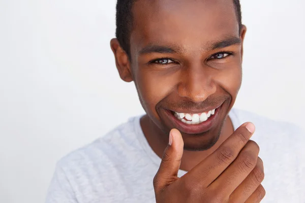Cute guy laughing with hand covering mouth — Stock Photo, Image