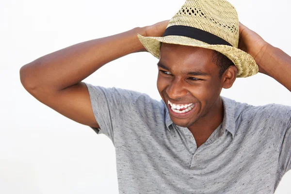 Carefree african american man smiling with hat — Stock Photo, Image