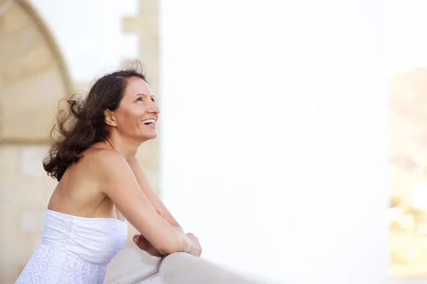 Laughing older woman standing outside — Stock Photo, Image