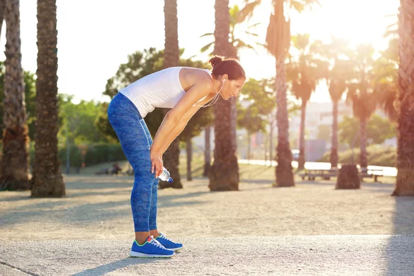 Tired woman resting after workout exercise — Stock Photo, Image