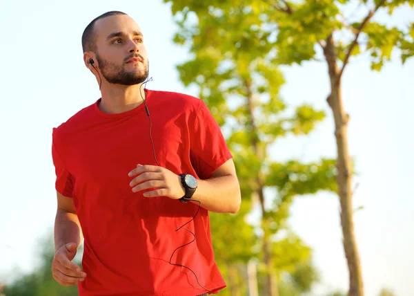Young man enjoying a run outdoors — Stock Photo, Image