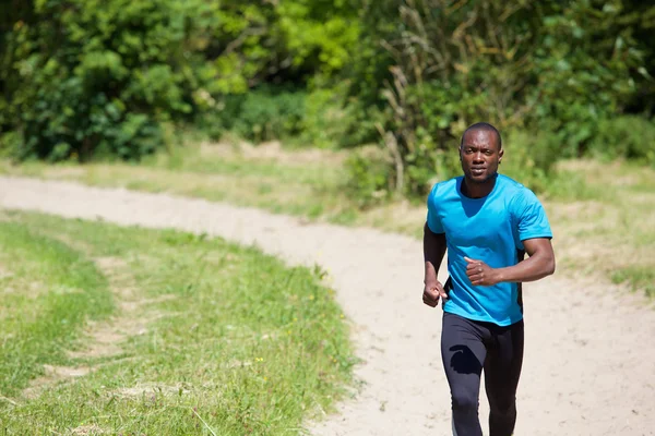 Active african american man running — Stock Photo, Image