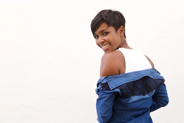 Beautiful african american woman looking over shoulder — Stock Photo, Image