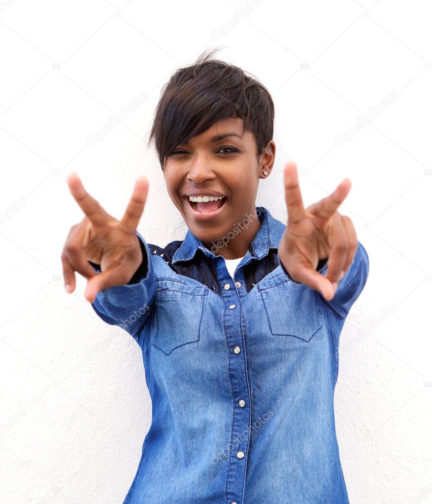 Cheerful african american woman with peace hand sign