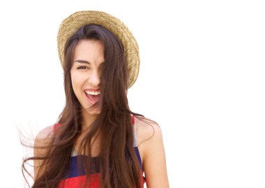 Cheerful girl with long hair posing against white background