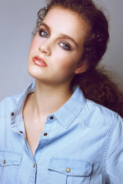 Sensual female fashion model in denim shirt — Stock fotografie