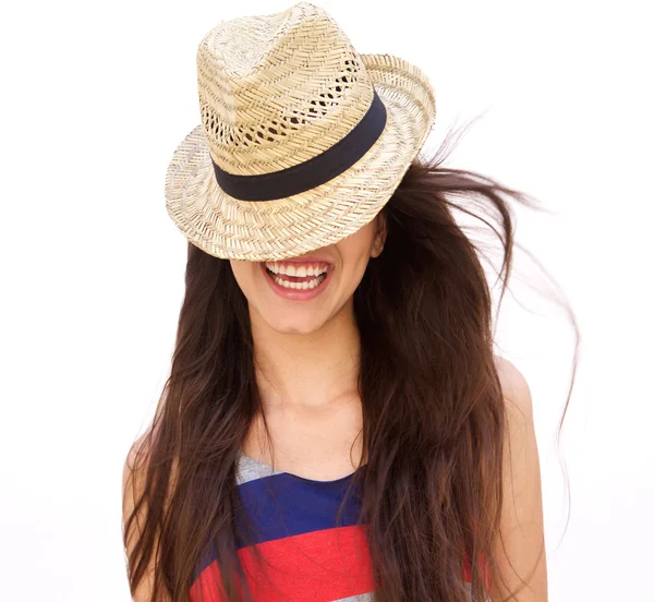 Laughing young woman with hat covering face — Stockfoto