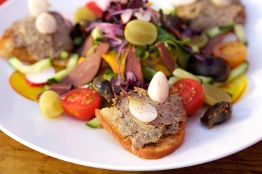 Fresh meat pate on toast with salad
