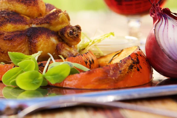 Roasted chicken and grilled pumpkin — Stock Image Roasted chicken and grilled pumpkin Stock Photo