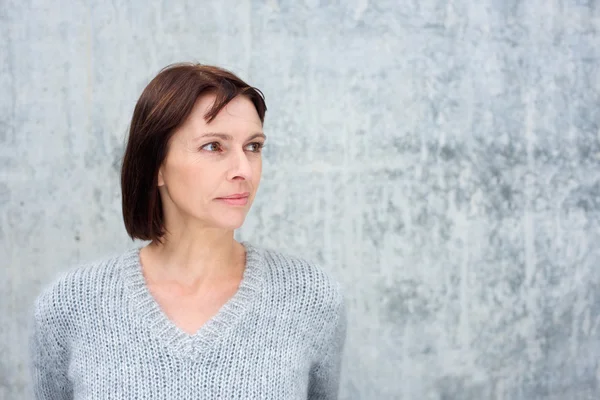 Attractive older woman looking away — Stock Photo, Image
