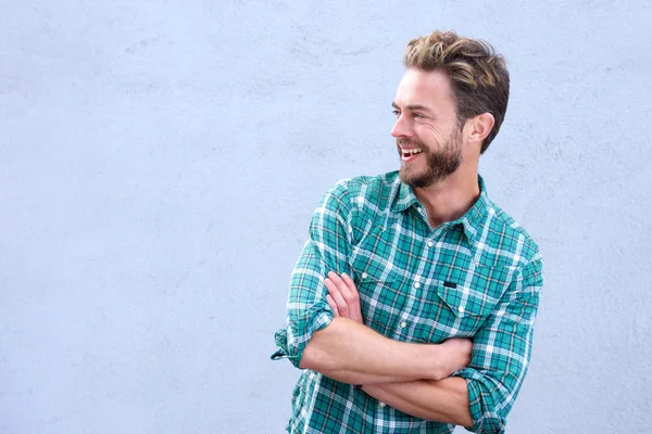 Handsome man laughing with arms crossed — Stock Photo, Image