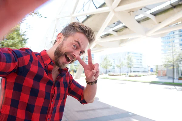 One handsome smiling man taking fun selfie — Stock Photo, Image