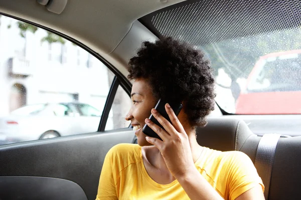 African woman on back seat — Stock Photo, Image