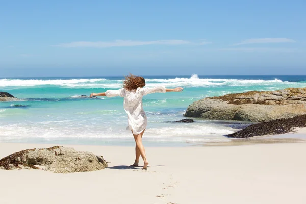 Behind of young woman walking — Stock Photo, Image