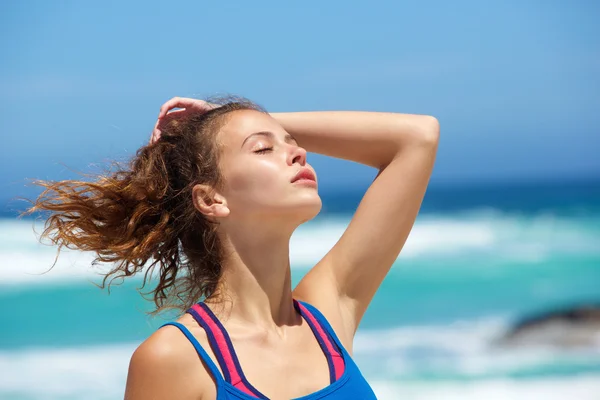 Young woman at the beach Stock Picture