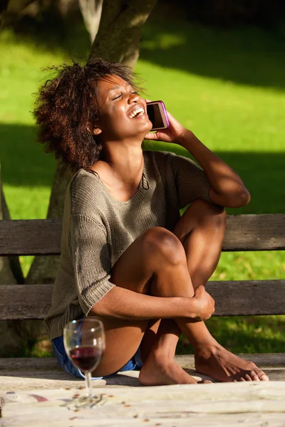 https://st2.depositphotos.com/1715570/i/600/depositphotos_101684878-stock-photo-happy-black-woman-sitting-outside.jpg