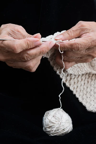 Older woman crocheting Stock Photo