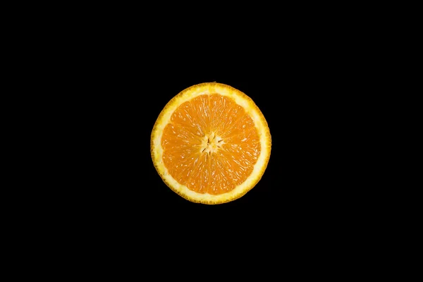 Sliced fresh orange on a deep black backround — Stock Photo, Image