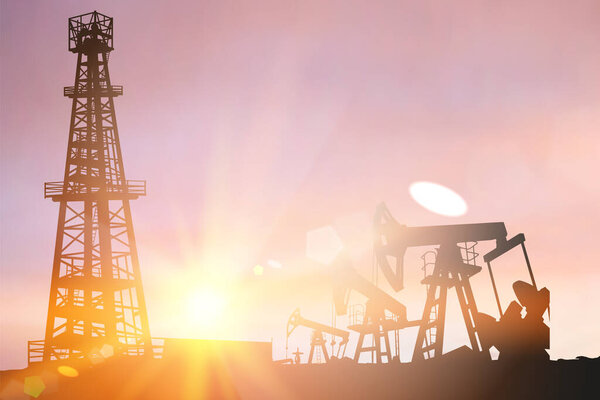 Силуэт Дарка нефтяной установки и насосов во время заката.