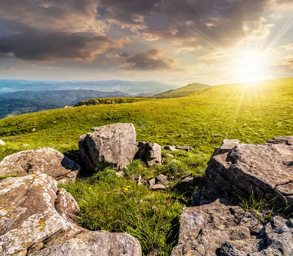 Summer landscape with stones on the hill at sunset — Stock Photo, Image