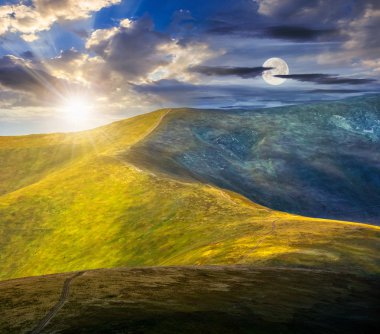 bir çayır yamaca yolda