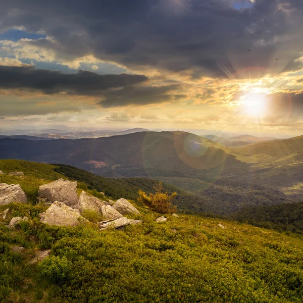 Boulders on mountain top at sunset — Stock Photo, Image