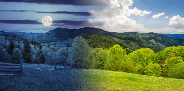 Fence on hillside meadow in mountain — Stock Photo, Image