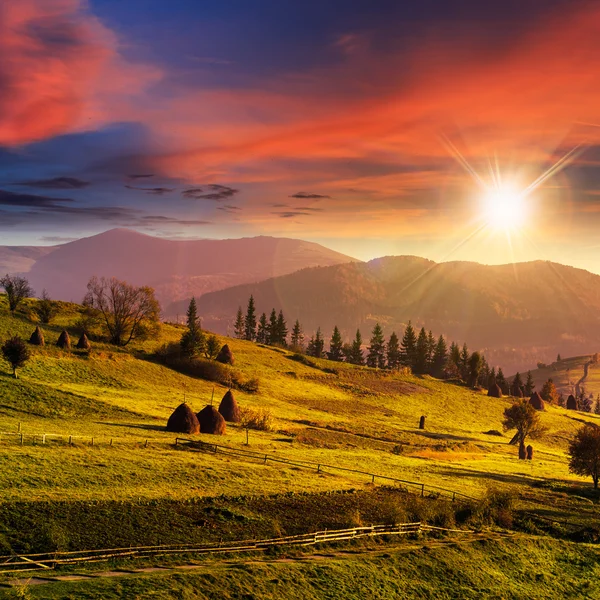 Path near field with haystacks at sunset — Stock Photo, Image