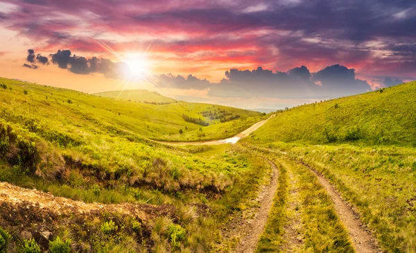 Path through highland meadows at sunset — Stock Photo, Image