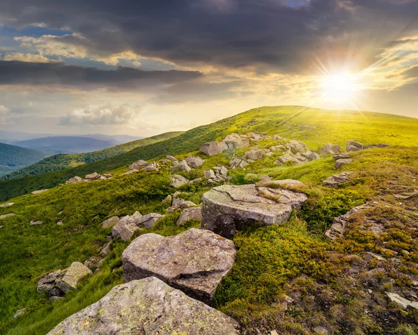 White boulders on the hillside at sunset — Stock Photo, Image