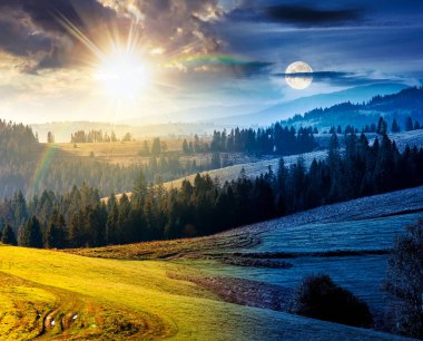 Sonbahar ekinoksunda çimenli tepede bir orman. Gündüz ve gece zaman kavramını değiştirir. Yuvarlanan otlaklı güzel kırsal manzara. Alacakaranlıkta güneş ve ayın olduğu dağlık bir kırsal. Sıcak Ekim havası