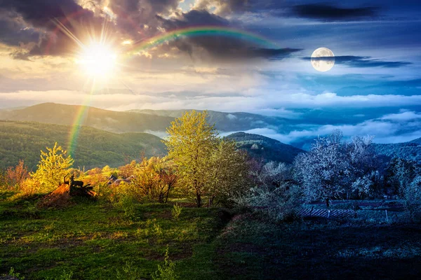 Sis içindeki dağ manzarası. Gündüz ve gece zaman kavramını değiştirir. Baharda yemyeşil çayırlarda, alacakaranlıkta güneş ve ay varken. Vadinin güzel manzarası. mevsimsel eşitlik ve kayma şablonu