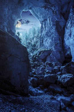 Cetatile cave sculpted by river in romanian mountains at night clipart