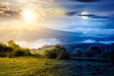 Sis içindeki dağ manzarası. Gündüz ve gece zaman kavramını değiştirir. Baharda yemyeşil çayırlarda, alacakaranlıkta güneş ve ay varken. Vadinin güzel manzarası. mevsimsel eşitlik ve kayma şablonu