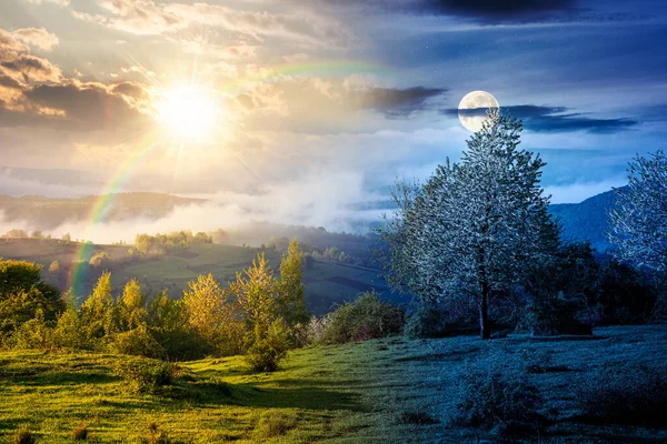 Sis içindeki dağ manzarası. Gündüz ve gece zaman kavramını değiştirir. Baharda yemyeşil çayırlarda, alacakaranlıkta güneş ve ay varken. Vadinin güzel manzarası. mevsimsel eşitlik ve kayma şablonu