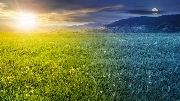 Fresh grass  meadow near the mountains day and night — Stock Photo, Image