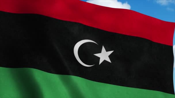 Libysche Nationalflagge weht im Wind, blauer Himmel im Hintergrund. 4K — Stockvideo
