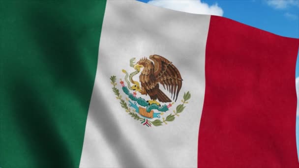 Mexico vlag op een vlaggenmast zwaaiend in de wind, blauwe lucht achtergrond. 4K — Stockvideo