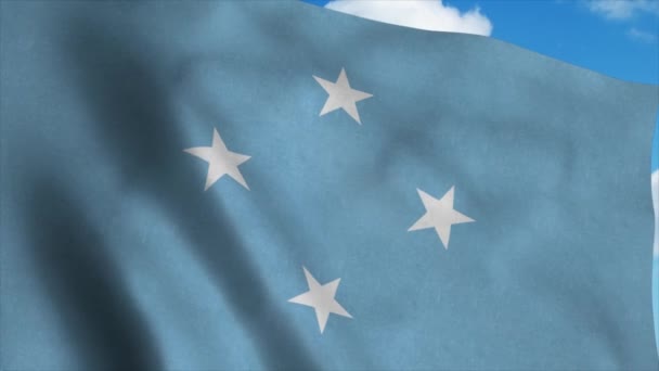 Micronesia vlag op een vlaggenmast zwaaiend in de wind, blauwe lucht achtergrond. 4K — Stockvideo