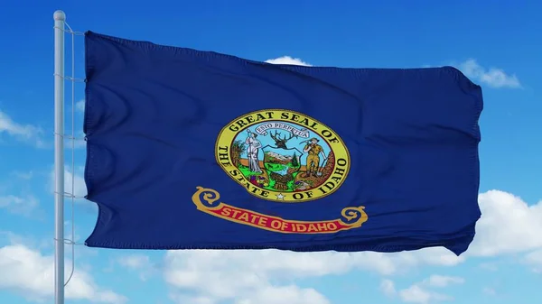 Bandeira de Idaho em um mastro acenando ao vento, fundo azul do céu. Renderização 3d — Fotografia de Stock