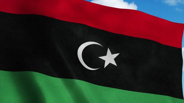 Líbia Nemzeti zászló lengett a szélben, kék ég háttér. 3D-s renderelés — Stock Fotó